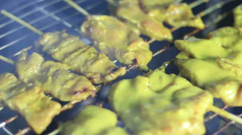 Close up cooking pork satay on grill Stock Footage 44456757