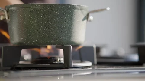 Close Up of Cooking Pot Heating on Gas Stove Stock Footage 336466784