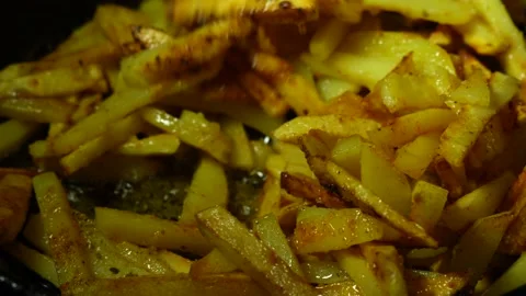 Close-up of the cooking process of fried potatoes Stock Footage 231105256