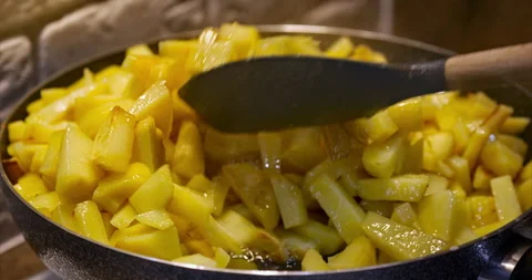 Close-up of the cooking process of fried potatoes. Pieces of potatoes are fried Stock Footage 236724093