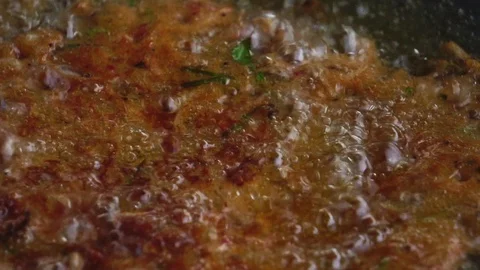 A close-up cooking process by the process of frying Stock Footage 106396609