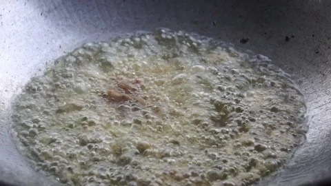 A close-up cooking process by the process of frying Видео 106396613