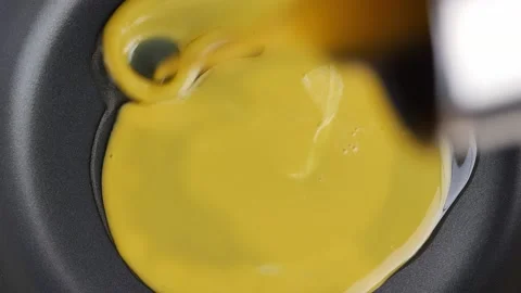 Close up cooking scramble egg on hot non stick pan. Egg cooking. Breakfast menu. Stockbeeldmateriaal 232942672