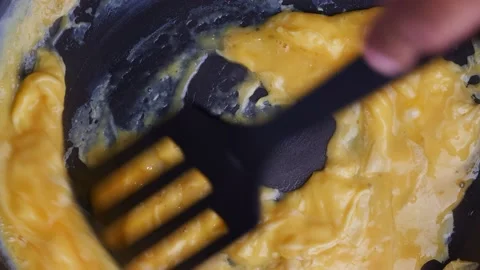 Close up cooking scramble egg on hot non stick pan. Egg cooking. Breakfast menu. Stockbeeldmateriaal 232942724