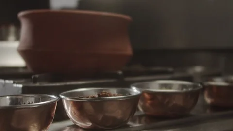 Close-up of cook's hand taking an anise from bowl. Slow motion video Stock Footage 124772274