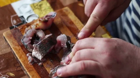 Close up of cooks hands cleaning the fish Stock Footage