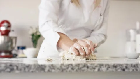 Close-Up: Cook's Hands Kneading Dough on Granite Countertop 4K Cinematic 動画素材 246947665