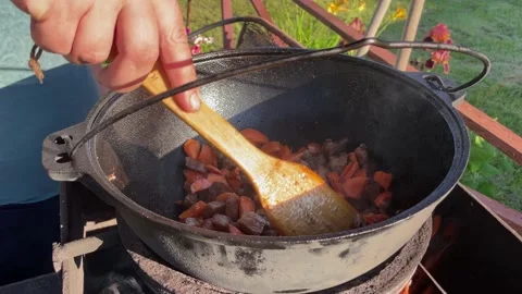 Close-up of the cook's hands stirring meat Stock Footage 200842900