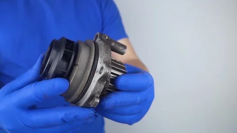 Close-up of the cooling system pump. Old car fluid pump. Replacement of spare pa Video stock 241559860