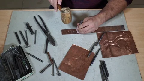 Close-up copper-smith work. Art smiting work progress   Stock Footage 82623625