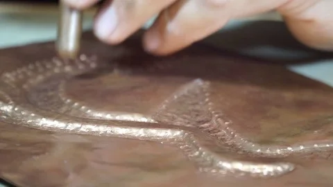 Close-up copper-smith work. Art smiting work progress   Stock Footage 82624216