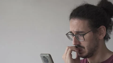 Close up with copy space of anxious man checking smartphone and biting his nails Stock Footage 161552393