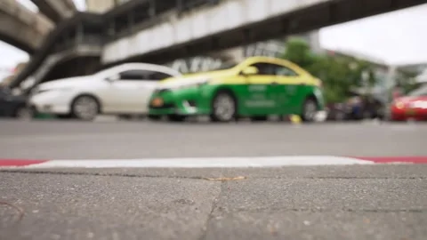 Close up copy space asphalt sidewalk in the foreground and blurred background Stock Footage 288952628