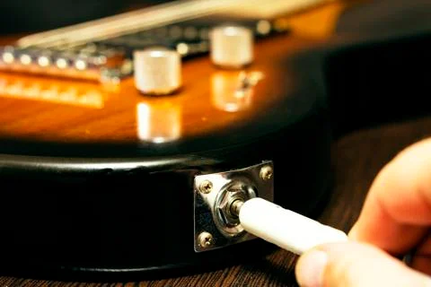 Close-up of the cord connection socket. of an electric guitar. Stockfoto's