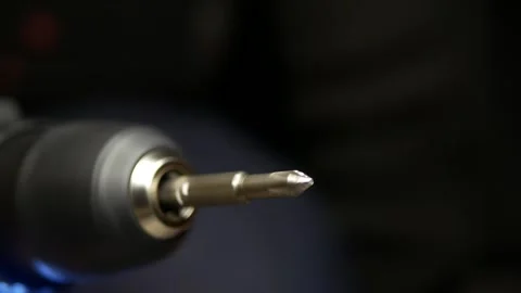 Close-up of cordless screwdriver. Screwdriver attachment rotates at speed. Stock Footage 303258163