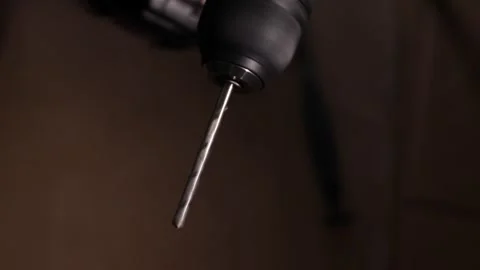 Close-up of a cordless screwdriver with a spinning drill bit in motion, cap.. Stock Footage 320738553