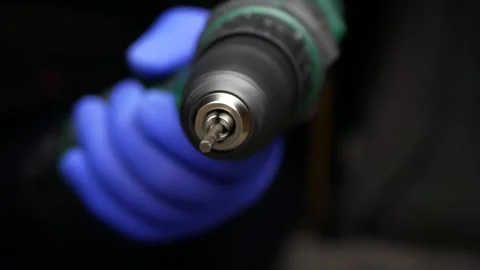 Close-up of cordless screwdriver. Torx screwdriver bit is rotating at speed. Stock Footage 303114678