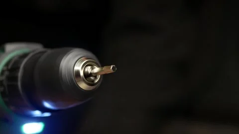 Close-up of cordless screwdriver. Torx screwdriver bit rotates at speed. Stock Footage 303114679