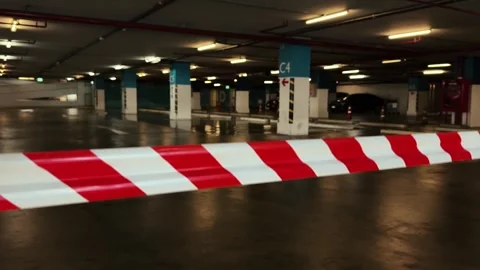 Close up of cordoned off with red and white barrier tape shaking from the wind Stock Footage 320161047