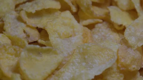 Close-up of Corn Flakes spinning, crispy cornflakes, healthy eating Stock Footage 247354541