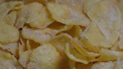 Close-up of Corn Flakes spinning, crispy cornflakes, healthy eating Stock Footage 247354792
