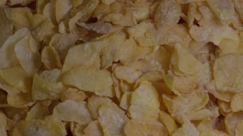 Close-up of Corn Flakes spinning, crispy cornflakes, healthy eating, Top view Stock Footage 247354942