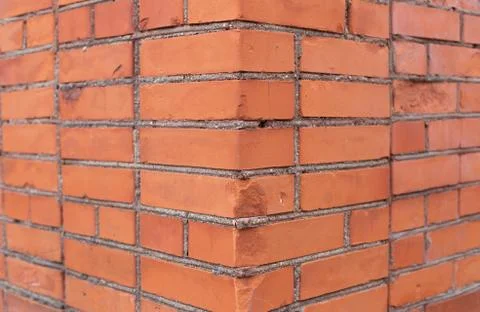 Close-up corner of a red brick wall Stock Photos