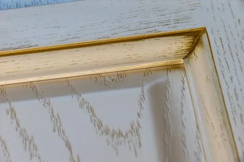 Close-up corner of a textured white classic kitchen facade with gilding and i Stock Photos