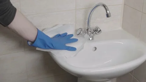 Close-up Corona virus cleaning and disinfection of sink. Pandemic prevention. Stock Footage