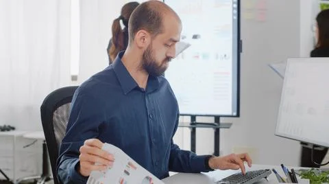Close up of corporate employee using keyboard and computer Foto stock