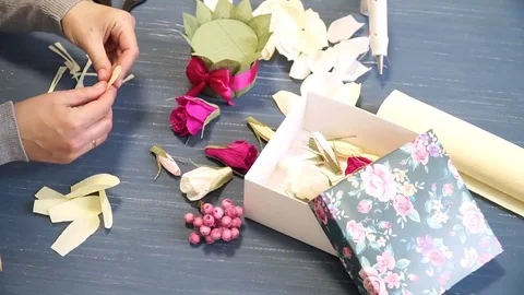 Close-up of corrugated paper hack bright pink in female hands. Female decorator Stock Footage 72630524