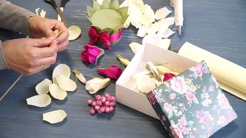 Close-up of corrugated paper hack bright pink in female hands. Female decorator Stock Footage 72630830