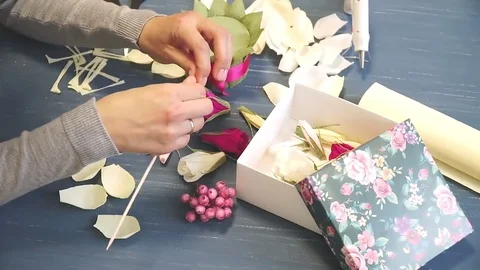 Close-up of corrugated paper hack bright pink in female hands. Female decorator Stock Footage 72631032