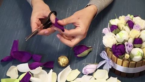 Close-up of corrugated paper hack bright pink in female hands. Female decorator Stock Footage 72683172