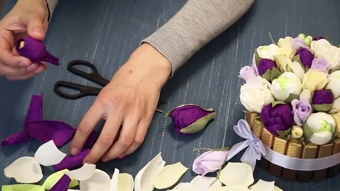 Close-up of corrugated paper hack bright pink in female hands. Female decorator Stock Footage 72683374