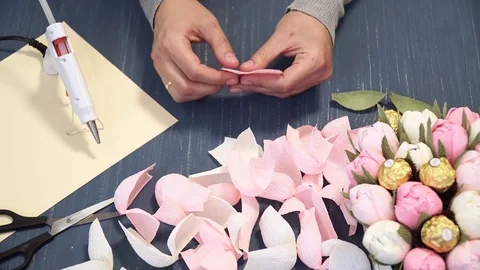 Close-up of corrugated paper hack bright pink in female hands. Female decorator Stock Footage 72683717
