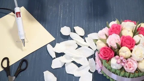 Close-up of corrugated paper hack bright pink in female hands. Female decorator Stock Footage 72684012