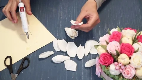 Close-up of corrugated paper hack bright pink in female hands. Female decorator Stock Footage 72684268