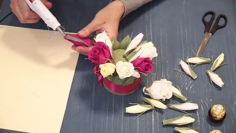 Close-up of corrugated paper hack bright pink in female hands. Female decorator Stock Footage 72752462