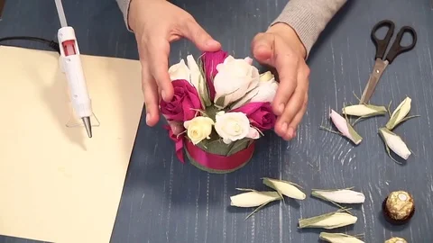 Close-up of corrugated paper hack bright pink in female hands. Female decorator Stock Footage 72753131