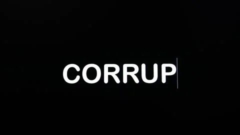 Close up of CORRUPTION being typed into computer monitor screen with 스톡 동영상 259324817