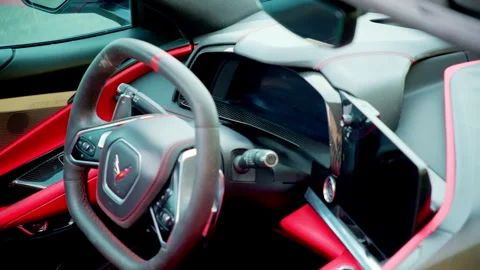 Close up of Corvette steering wheel and modern interior design. High performance Vidéo 311908112
