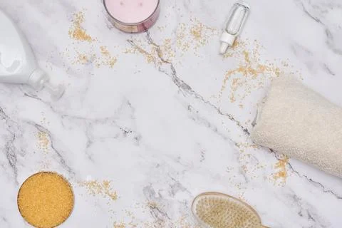 A close up of cosmetics products on a marble table Stock Photos