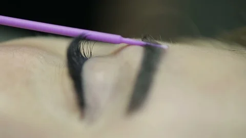 Close up of cosmetologist making permanent makeup.Microblading procedure. Stock Footage 87412036