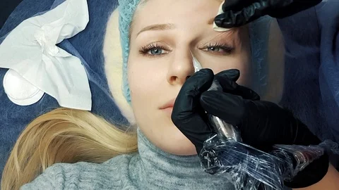 Close up of cosmetologist making permanent makeup.Microblading procedure Video stock 109546331