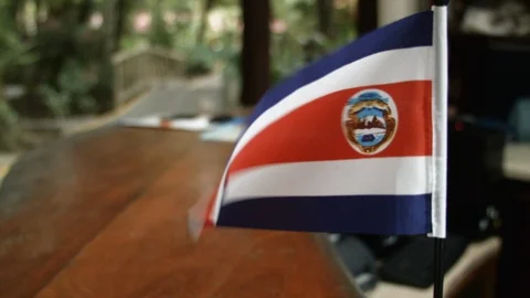 Close up of Costa Rican flag flapping in light breeze, Tortuguero, Costa Rica Stock Footage 141249203
