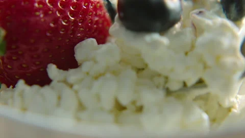Close up cottage cheese with fresh berries Stock Footage 166160338