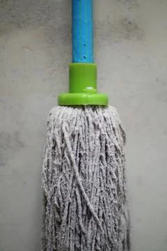 Close-up of a cotton string mop, designed for effective floor cleaning and .. Stock Photos