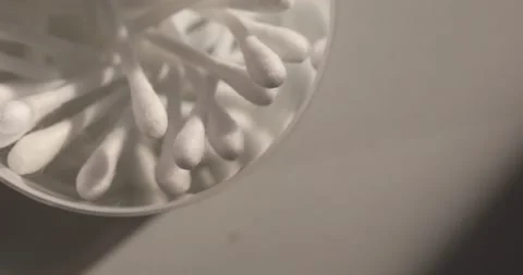 Close-up of Cotton Swabs in a Round Transparent Container Stock Footage 296157660