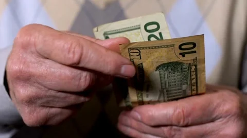 Close-up counting stacks of dollars by hand. Finance and money payment concep Stock Footage 266472358